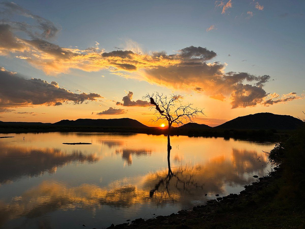 Sunset over the water. Madikwe Game reserve.